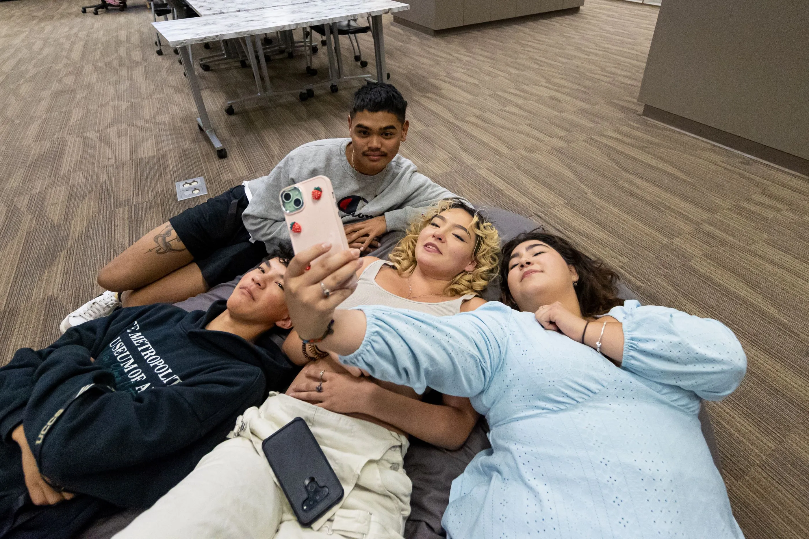 Student on the floor in Student Life