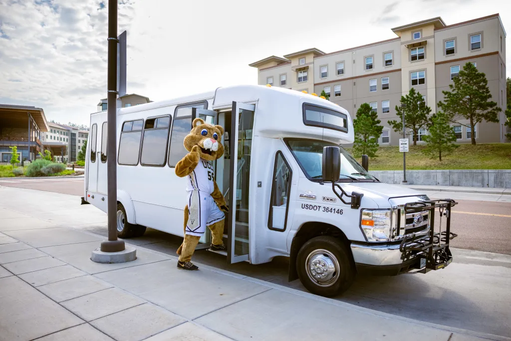 Clyde Climbing on a shuttle bus